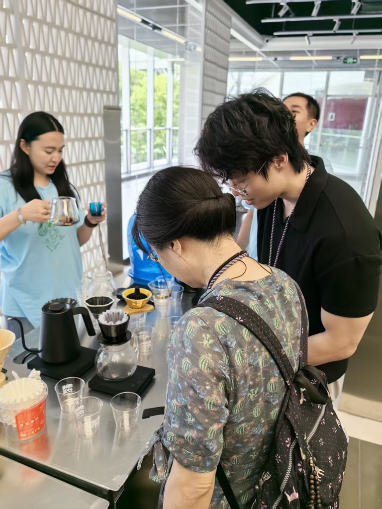 Explaining pour-over setup at the brew station